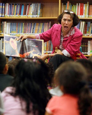 Kansas first lady Mary Brownback mimics the yelling llama from the book "Llama Llama Red Pajama" as she reads to kindergartners at Scott Technology Magnet School Thursday. Brownback was part of the "Read for the Record" program which was attempting to set a world record by reading to two million children.