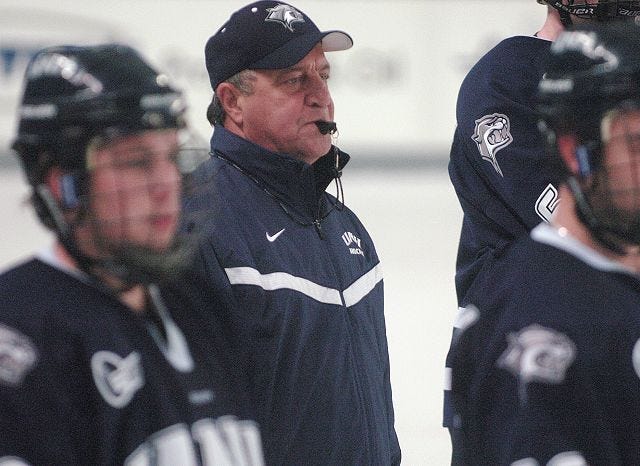John Huff/Staff photographer
UNH hockey coach Dick Umile watches intently as the Wildcats go through their paces in preparation for tonight's season opener at Boston University.