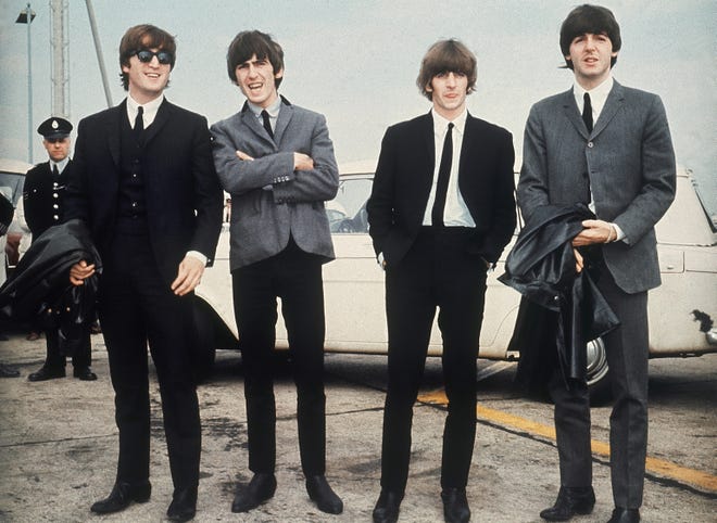 The Beatles leave London airport in 1964.