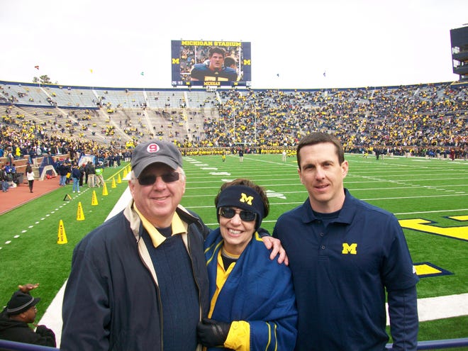 Daily News sports writer Rick Smith (left) and his family continued their annual trip to college football stadiums last weekend when they visited Michigan Stadium.