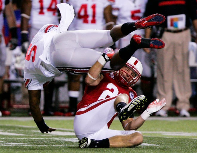 Ohio State quarterback Braxton Miller (5) is upended by Nebraska's Lance Thorell in the first half of Saturday's game.