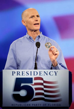 Florida Gov. Rick Scott delivers his keynote address at a Florida Republican Party Presidency 5 Convention Saturday, Sept. 24, 2011, in Orlando, Fla. (AP Photo/John Raoux)