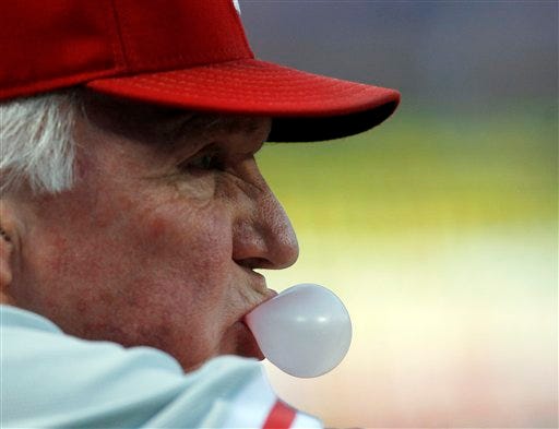 Philadelphia Phillies manager Charlie Manuel looks on from the
dugout during the first inning of a baseball game against the
Atlanta Braves in Atlanta, Wednesday, Sept. 28, 2011. (AP
Photo/John Bazemore)