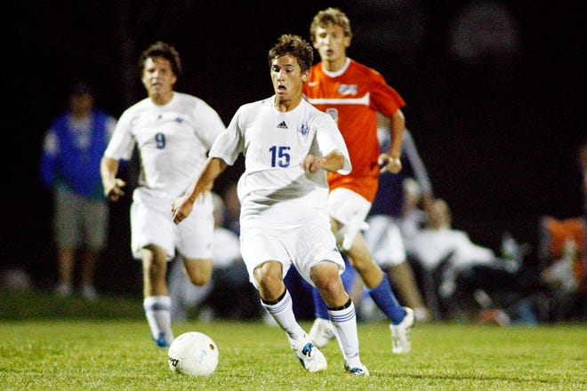 Josh Farris of Lutheran High School makes a drive towards the Riverton goal during the Boys Class A Soccer Regional in Rochester Tuesday, Oct. 11, 2011.