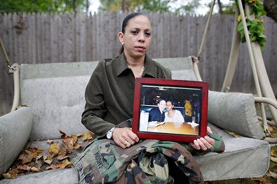 Carmen Cardona of Norwich, Conn., a Navy veteran who wed her partner last year, is fighting the Defense of Marriage Act.