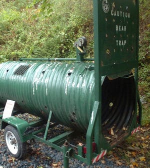 The Pennsylvania Game Commission deployed this bear trap at the home of John Sittig on Wednesday, Oct. 12, 2011, in order to capture and relocate a bold bear who recently killed four goats.