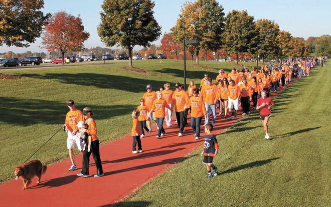 The Letcavits family leads the 2011 Walk to End Alzheimer’s on Saturday at Jackson North Park.
