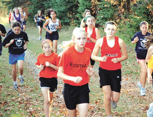 A pack of girls runners get started at the Straits Area Conference cross country middle school meet Tuesday at the Rudyard School Farm. Sault Ste. Marie won both the boys and girls middle school team titles.