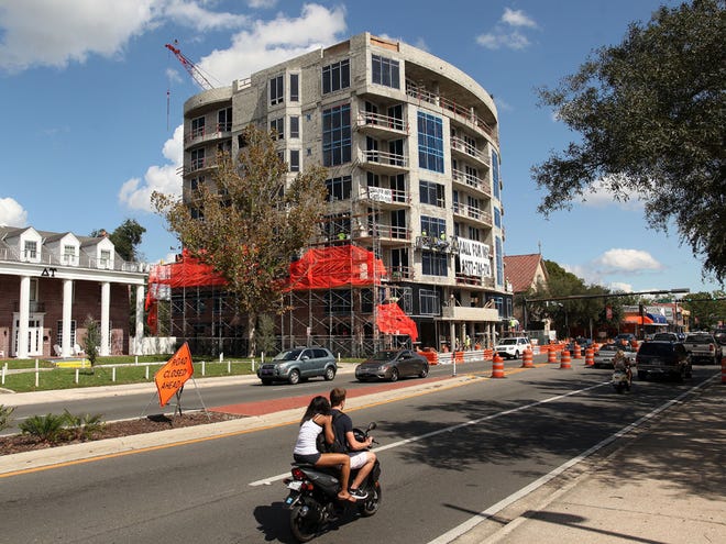 Construction continues on Stadium Club apartments on W. University Avenue Oct. 13.