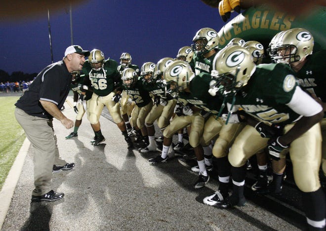 Coach Scott Garcia gets ready to lead GlenOak onto the field prior to the Oct. 7 game vs. Lake.