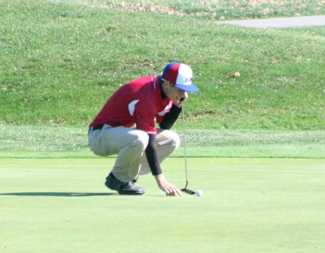 United High School senior Jake Gavin lines up a putt Saturday in Bloomington at the Class A State Golf Tournament.