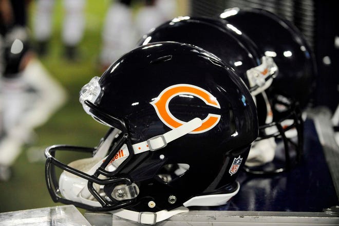 Chicago Bears helmets sit on the sideline in the fourth quarter of an NFL football preseason game against the Tennessee Titans on Saturday, Aug. 27, 2011, in Nashville, Tenn. The Titans won 14-13.