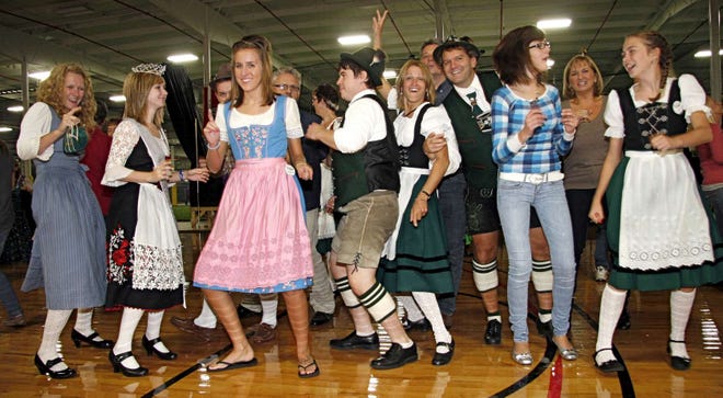 Oktoberfest attendees dance Saturday, Oct. 2, 2010, at the L.E.A.D. Sports Center in Loves Park.