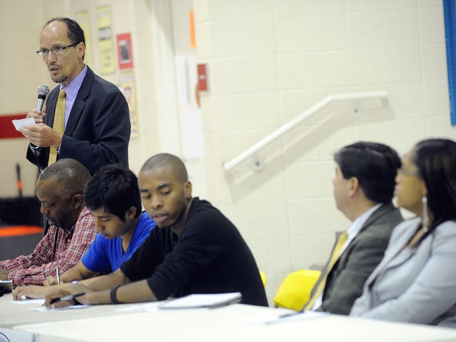 Thomas Perez, Assistant Attorney General for the Civil Rights Division of the United States Department of Justice, left, speaks at a town hall meeting Thursday about Alabama’s HB56 law, at Glen Iris Elementary School in Birmingham. Perez asked Alabama immigrants to report any problems caused by that state’s tough new law against illegal Immigration.