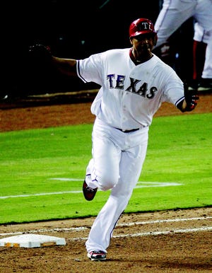 Texas Rangers' Nelson Cruz rounds the bases after hitting a two-run home run against the Detroit Tigers during the seventh inning at Game 6 of baseball's American League championship series Saturday, Oct. 15, 2011, in Arlington, Texas. (AP Photo/Eric Gay)