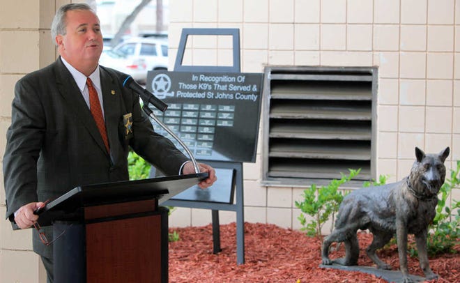 St. Johns County Sheriff David Shoar speaks during a dedication of Spirit, right, a bronze statue to commemorate and memorialize the work of K-9 officers and their handlers, at the Sheriff's Office Memorial Courtyard on Tuesday morning, October 18, 2011. BY DARON DEAN, daron.dean@staugustine.com