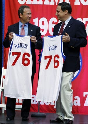 New Philadelphia 76ers owner Joshua Harris, left, and Chief
Executive Officer Adam Aron pose for photographs during a news
conference at the Palestra Tuesday, Oct. 18, 2011, in Philadelphia.
The sale ends Comcast-Spectacor's 15-year run of ownership. (AP
Photo/Matt Rourke)