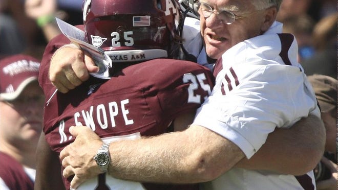 Texas A&M head coach Mike Sherman, right, says practicing at game speed helps Ryan Swope's chemistry with his team.