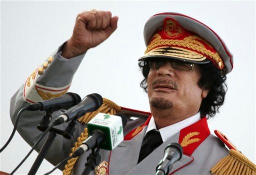 FILE - In this Saturday, June 12, 2010 file photo, Libyan leader Moammar Gadhafi talks during a ceremony to mark the 40th anniversary of the evacuation of the American military bases in the country, in Tripoli, Libya. The Associated Press is aware of reports that Moammar Gadhafi has been captured in Sirte. The chief spokesman for the revolutionary National Transitional Council Jalal el-Gallal and the council military spokesman Abdul-Rahman Busin told the AP that those reports are unconfirmed.