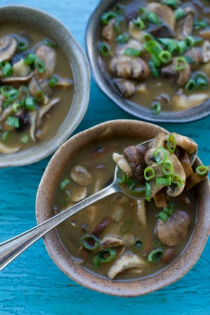 This Sept. 12, 2011 photo shows mushroom and miso soup in Concord, N.H. This recipe is a quick and convenient meal from Rocco DiSpirito's weekly column dedicated to healthy versions of the foods we love. (AP Photo/Matthew Mead)