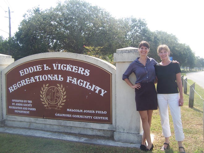 Market manager Hannah Murray and market organizer and Lincolnville resident Sue Agresta stand with the sign for Eddie Vickers Park, where the Lincolnville Farmers' Market will be held.