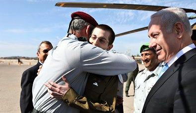 Gilad Shalit with Prime Minister Benjamin Netanyahu of Israel, right, and others on Tuesday.