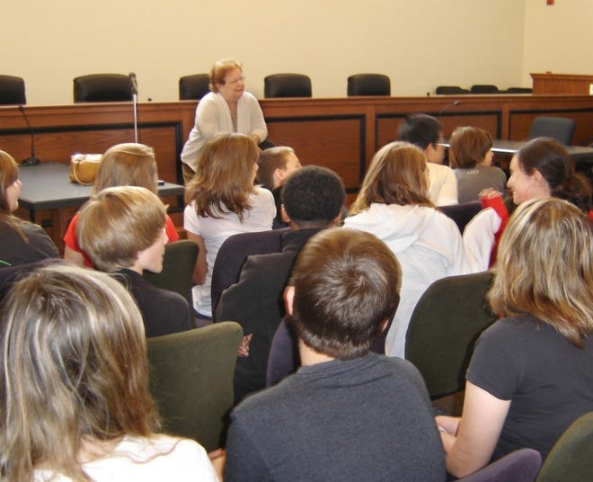 Township Committeewoman Joan Hinkle addresses about 40 students
from Walnut Street School in the municipal courtroom about the jobs
of elected officials in a municipality. She also is member of the
Delanco Women’s Civic Club, which sponsored the field trip. 
 Kristen Coppock