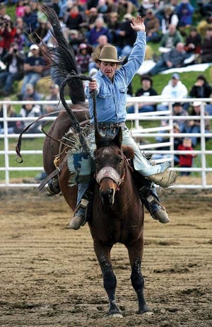 Photo by Tracy Klimek/New Jersey Herald Tyler Foster competes in Saddlebronc Riding at the Wantage Pro Rodeo at Green Valley Farms in Wantage Saturday.