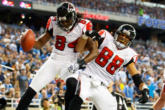 Atlanta Falcons wide receiver Roddy White (84) and tight end Tony Gonzalez (88) celebrate White's touchdown in the second quarter of an NFL football game in Detroit, Sunday, Oct. 23, 2011. (AP Photo/Rick Osentoski)