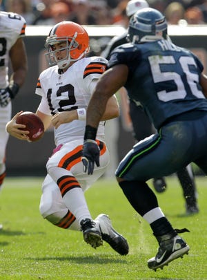 Cleveland Browns quarterback Colt McCoy (12) runs the ball against the Seattle Seahawks in the second quarter in an NFL football game Sunday, Oct. 23, 2011, in Cleveland. The Browns won 6-3.