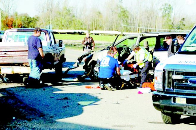 Emergency personnel respond to the scene of the crash.