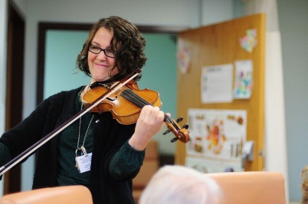 Gina Bagnoli, music and activity therapist at Ellwood City
Hospital's Behavioral Health Unit, plays the violin for
residents.