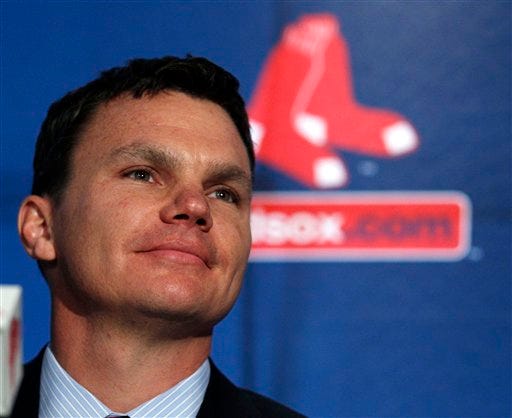 Boston Red Sox new general manager Ben Cherington listens to a reporter's question during a news conference at Fenway Park in Boston, Tuesday, Oct. 25, 2011.