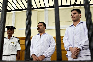 The defendants Awad Ismail, center, and Mahmoud Salah, right, in the courtroom last month.