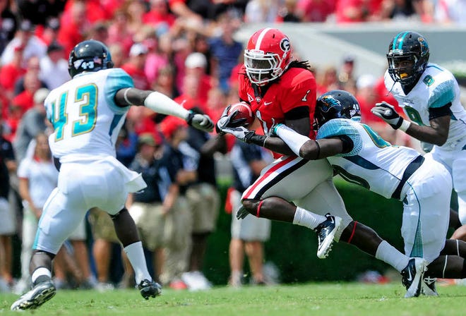 Georgia Bulldogs running back Isaiah Crowell (1) runs the ball in the first quarter as Georgia faces Coastal Carolina in an NCAA college football game at Sanford Stadium on Saturday, September 17, 2011 in Athens, Ga. (David Manning/Staff/david.manning@onlineathens.com)