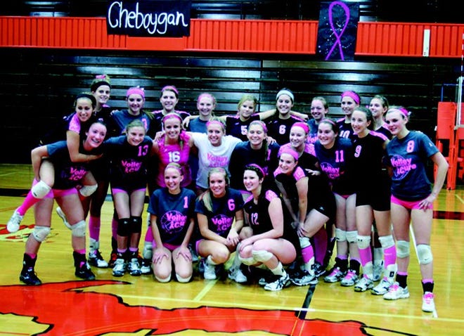 TOP:?Members of the Cheboygan and Pellston volleyball teams pose for a picture after their match against on Thursday. Both teams wore the color pink to promote “Breast Cancer Awareness.” 
BOTTOM?RIGHT:?Pellston senior Tayler prepares to serve during the first set.