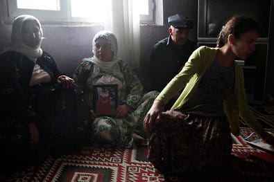 From left, Taubet Gungen; Mevlude Gungen; her husband, Selim; and her daughter Fatima. The family, like many in the region, has members fighting for the Kurdistan Workers' Party guerrilla movement and members fighting for the Turkish Army. Turkey and its Kurds have a long and acrimonious history.