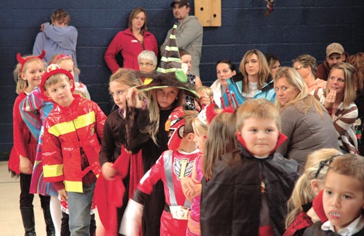 Students at Soo Township Elementary participated in a school-wide parade on Friday to show off their Halloween costumes to their friends and families. Many vampires, witches, ghosts and superheroes were viewed by the crowd.