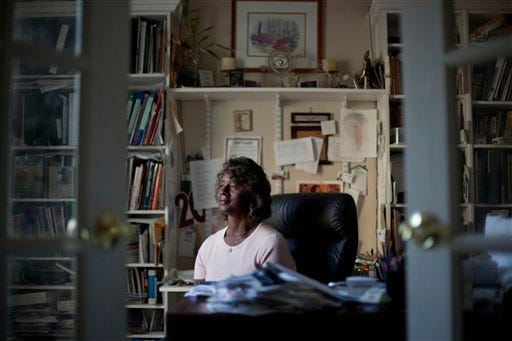 Lillian Wells, 60, faces foreclosure as she sits in her home Wednesday, Oct. 26, 2011 in Covington, Ga. Wells lost $122,000 in her life savings that was given to Ephren Taylor's company after hearing him speak at an Atlanta church. (AP Photo/David Goldman)
