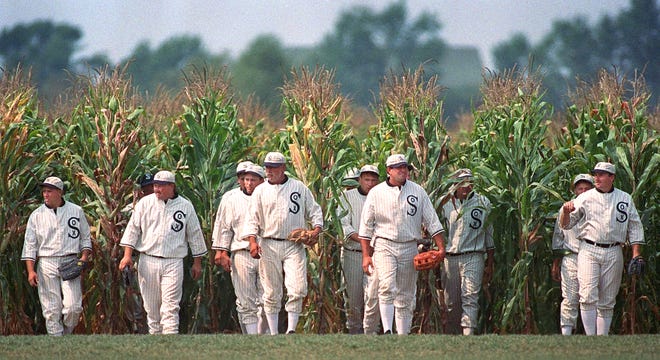In this 1997 photo, ghost players emerge from the cornfield at the "Field of Dreams" movie site in Dyersville, Iowa. An investment group headed by Bradley University graduates Mike and Denise Stillman is under contract to buy the land and ballpark where the movie was filmed.
