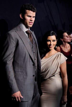 In this Aug. 31, 2011 file photo, newlyweds Kim Kardashian, right, and Kris Humphries attend a party thrown in their honor in New York. Kardashian is expected to file for divorce in Los Angeles on Monday, Oct. 31, 2011, according to a report confirmed by the producers of her reality show. Kardashian and Humphries were married on Aug. 20.