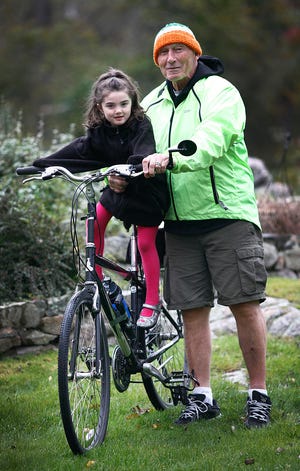 Bob Hayden of Hingham, a retired police offer and chief, with his 5-year-old granddaughter Victoria Hayden, 5 of Hanover.