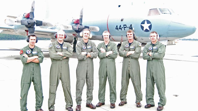 VP-30 pilots completing their air show check ride Oct. 28 are (from left) Lt. Nick Strelchuk, Lt. Frank Huebel, VP-30 Executive Officer Cmdr. Matt Ahern, Lt. Jon Lee, Lt. Tom Doran and Lt. John Perkins. "Strawberry 5" is in the background.