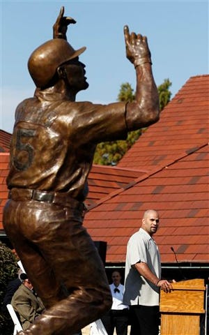 Baseball player Albert Pujols speaks during the dedication of a 10-foot, 1,100-pound bronze statue of the St. Louis Cardinals slugger Wednesday, Nov. 2, 2011, in Maryland Heights, Mo.