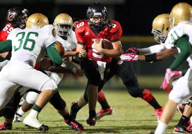Nease's (1) breaks through Creekside's defense during high school football action at Creekside Friday night, November 4, 2011. BY DARON DEAN, daron.dean@staugustine.com