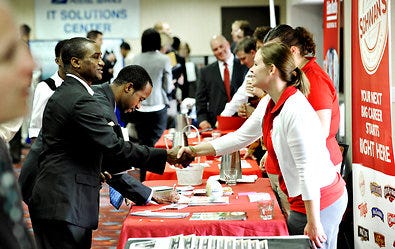 Job seekers at the Minneapolis Career Fair on Wednesday. Unemployment declined to 9 percent in October from 9.1 percent.