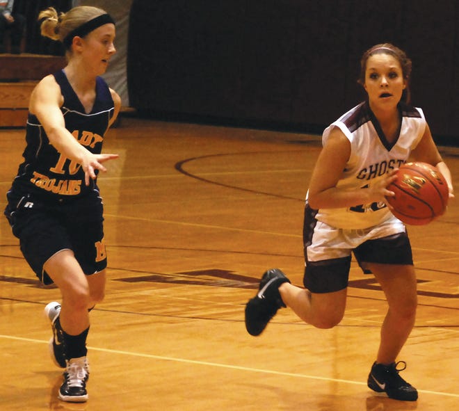 Anna Parr tries to make a move on an opponent during the 2010-11 basketball season.