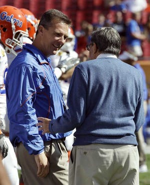 Chris O'Meara Associated Press Former Florida coach Urban Meyer (left) talks with Penn State coach Joe Paterno before the start of the Outback Bowl on Jan. 1 in Tampa.