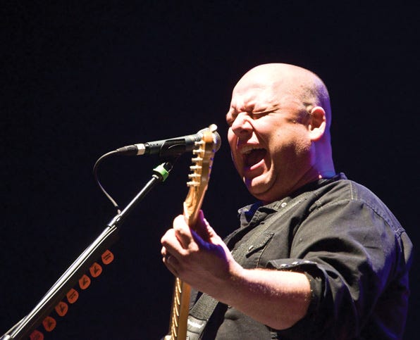 Lead singer Frank Black of the Boston based group The Pixies pours his heart out onstage at the Main Street Armory.