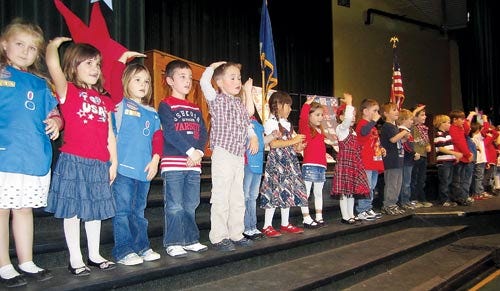 Photo by Katie Brenzel/New Jersey Herald 
Kindergartners sing and sign “God Bless America” Wednesday at the Green Hills School Salute to Veterans ceremony in Green.